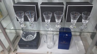 Six boxed Waterford cut glass wine glasses, a Stuart bowl and a Gleneagles water jug along with a