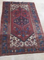 A hand knotted woollen Hamadan rug - 2.04m x 1.38m