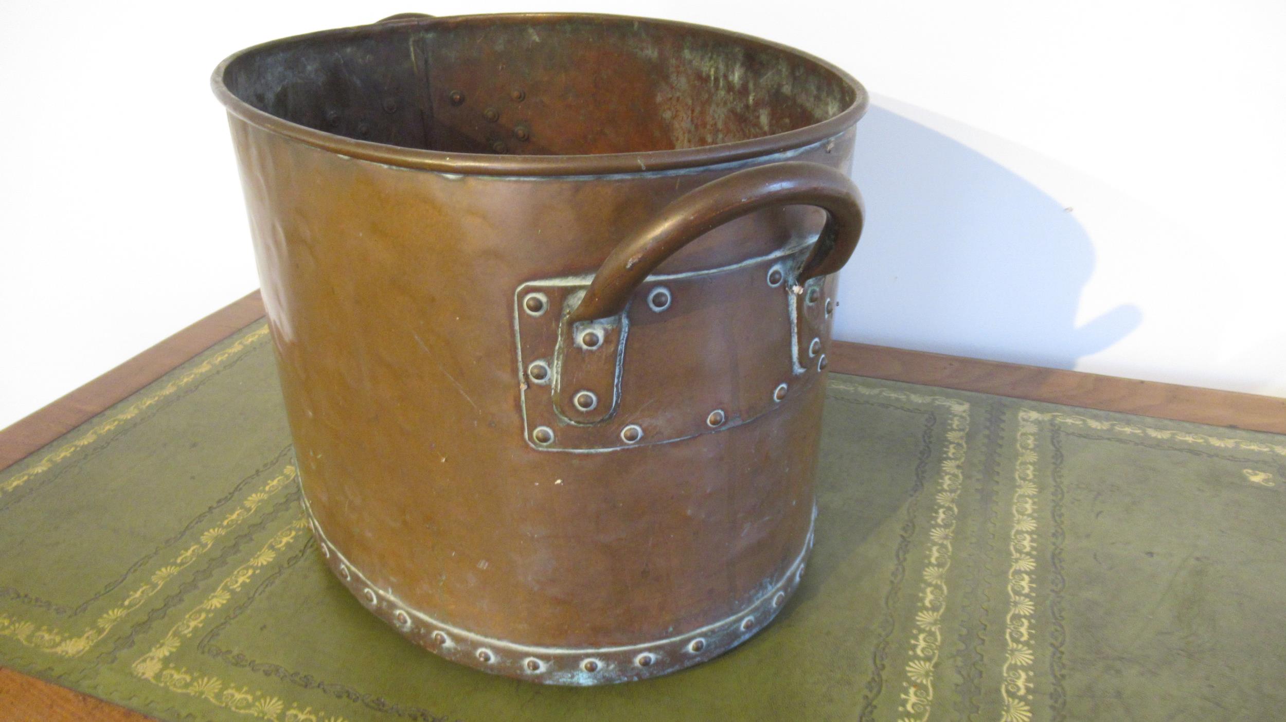 A hand hammered copper log bucket, riveted with twin handles, of oval shape with good patina - - Image 2 of 2