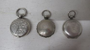 A Georgian silver pill box/locket pendant, 3cm - together with a Victorian silver sovereign case,