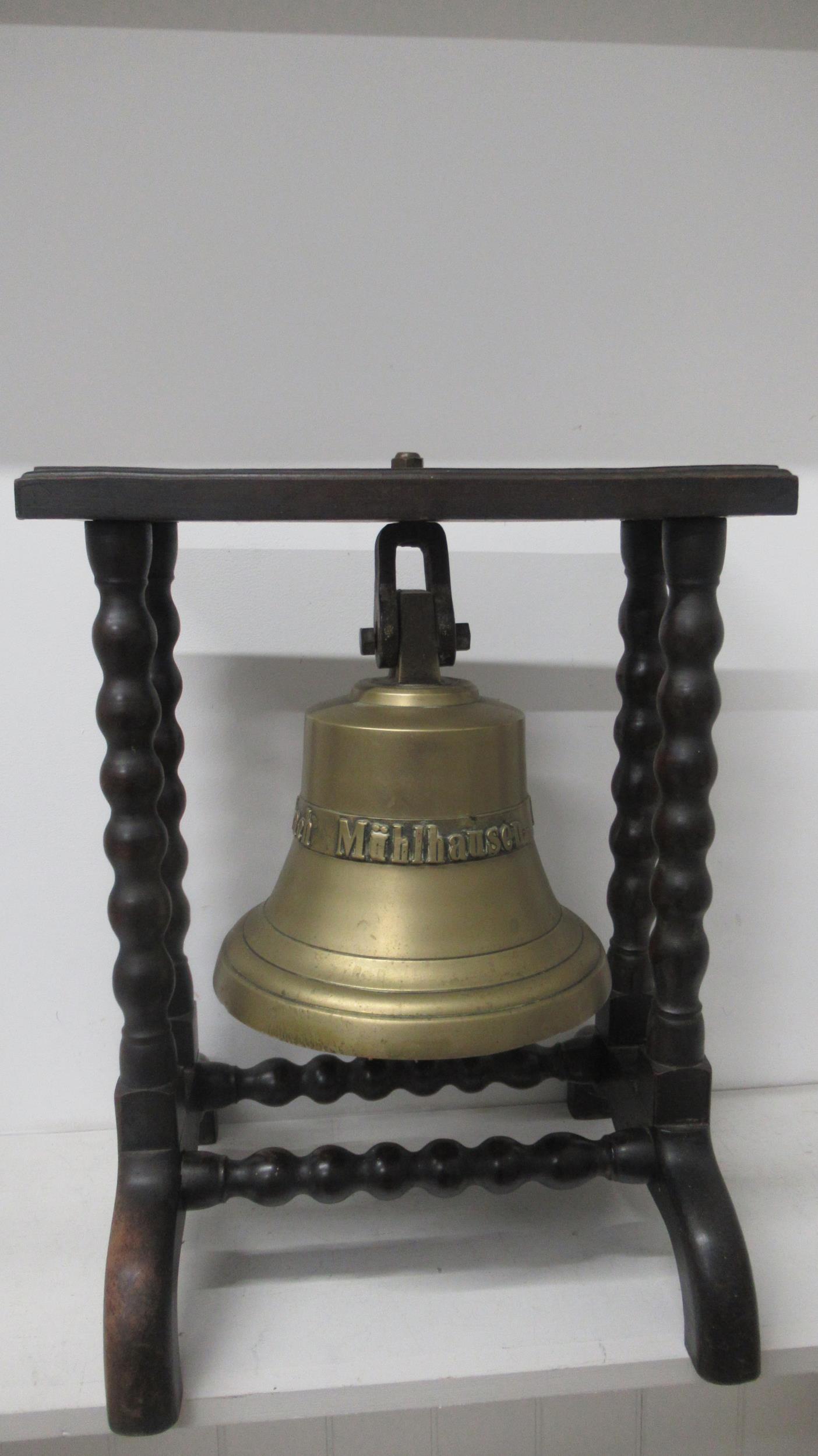 A ships bell on a stand inscribed Mihlhausen 1 Thur H & F Steinbach