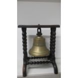 A ships bell on a stand inscribed Mihlhausen 1 Thur H & F Steinbach