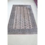 A Khara cream hand knotted woollen rug - 244cm x 155cm - original cost £775 - reasonably good