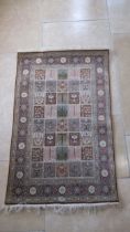 A hand woven Qoom silk rug - 120cm x 75cm - with certificate