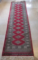 An Eastern hand knotted runner/rug - 280cm x 80cm