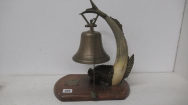 A dinner bell in the form of a dolphin