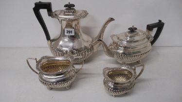 An Edwardian silver three piece tea set - Thomas Hayes, Birmingham 1904 with a matched late