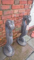 A pair of cast stone seahorses with a bronze finish - Height 79cm x Width 28cm