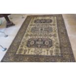 A hand knotted woollen Ardabil rug - 2.90m x 1.96m