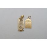 Two Egyptian 18ct yellow gold (hallmarked) pendants - 3.5cm and 2cm - approx weight 4.6 grams