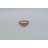 An 18ct rose gold (hallmarked) diamond solitaire ring - The central diamond approx 0.2ct and set