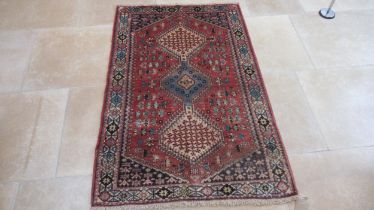 A hand knotted woollen Abadeh rug - 1.50m x 1.05m