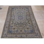 A hand knotted woollen Nain rug - 1.95m x 1.32m