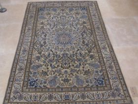 A hand knotted woollen Nain rug - 1.95m x 1.32m