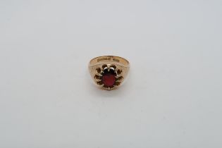 A 9ct yellow gold hallmarked red garnet ring, size Q, approx 5.5 grams