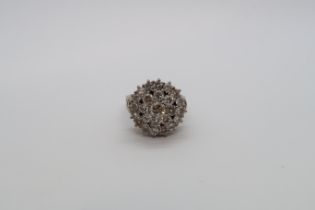 A 14ct (hallmarked) white gold diamond cluster ring - head size approx 17mm x 16mm - ring size L/M