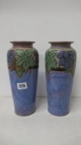 A pair of Royal Doulton Lambeth vases - 25cm