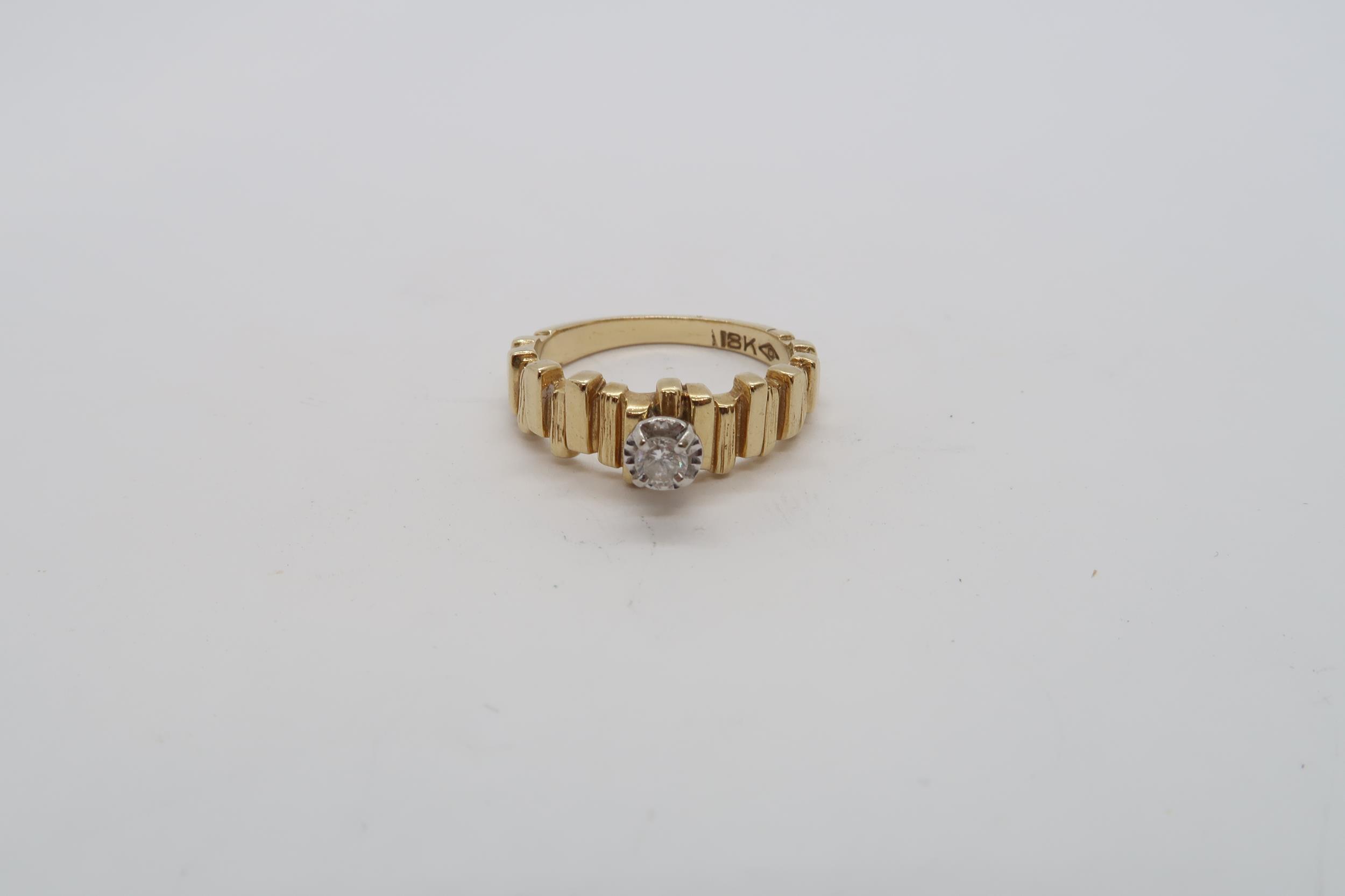 An 18ct yellow gold hallmarked single stone diamond ring, size L, approx 4.6 grams