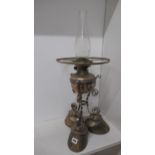 An unusual oil lamp mounted on three hoof feet