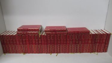 A set of 40 red leather bound hard back Agatha Christie novels with illustrations by Heron Books