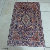 A Kashan hand knotted woollen rug - 2.18m x 1.30m