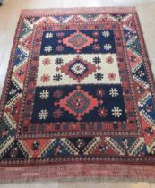 An Eastern hand knotted rug - 185cm x 135cm