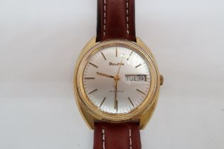 A gents Bulova automatic gold plated wristwatch - case 34mm - with day and date aperture - working