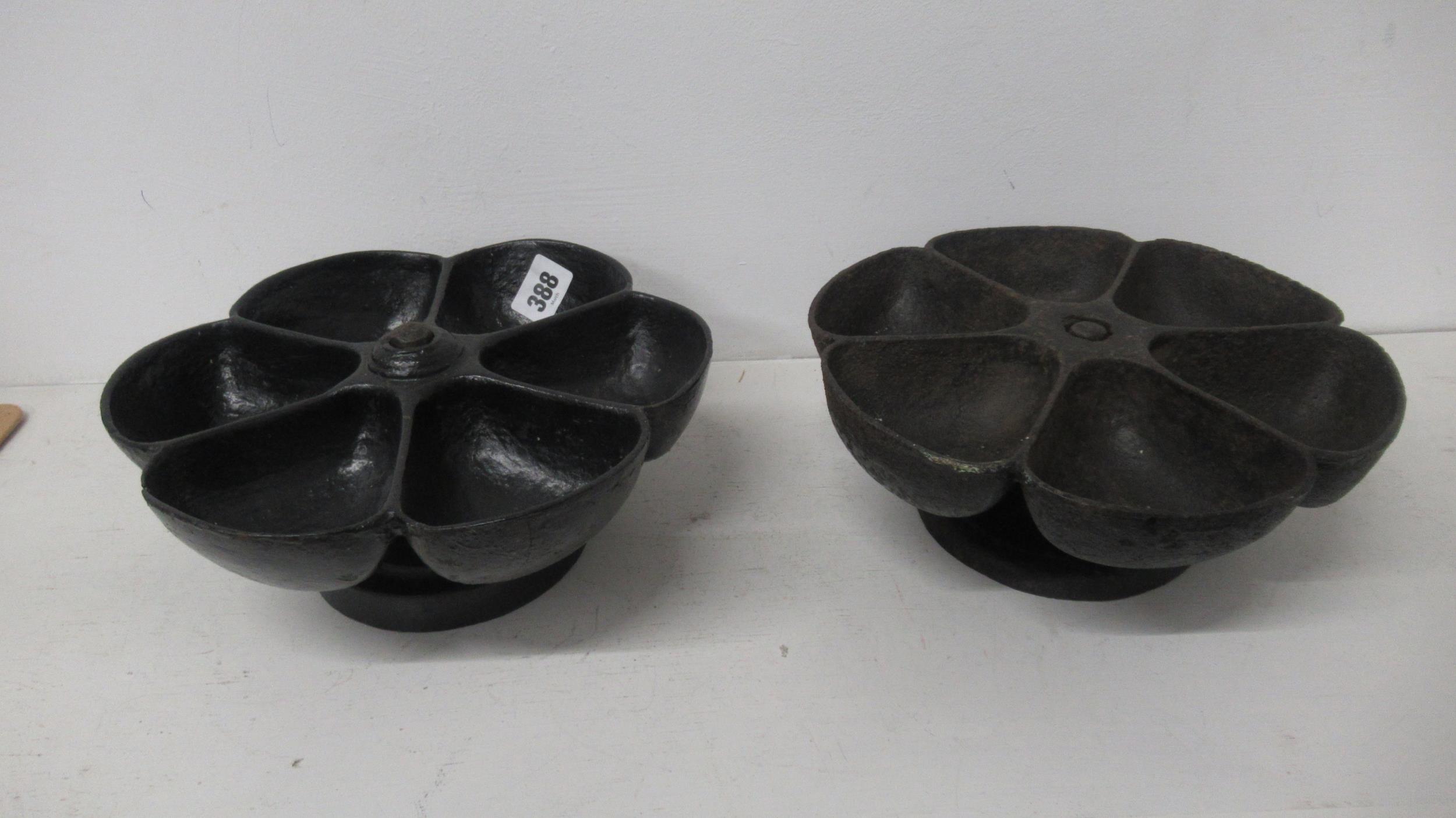 Two cobblers cast iron nail holders