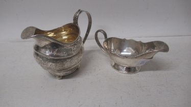 A George IV silver cream jug London 1820 - 10cm - together with a silver sauce boat, Sheffield