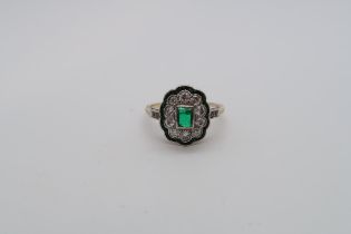 A 14ct hallmarked emerald and diamond cluster ring with diamond accent shoulders, size L, approx 2.8