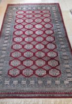 An Eastern hand knotted rug - 250cm x 150cm