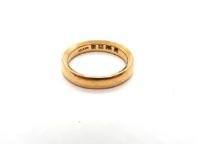 A 22ct hallmarked yellow gold wedding band, size L, approx 6.4 grams