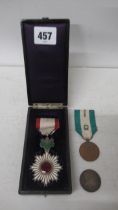 A Japanese Order of the Rising Sun Medal in Lacquer box together with a Japanese Red Cross silver