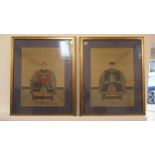 A pair of Chinese ancestral portraits on silk possibly 19th century - seated in formal dress -