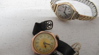Gold ladies watches, one with a plated strap
