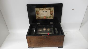 A 19th century rosewood and inlaid music box playing 8 airs on three bells, in working order - teeth