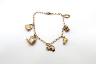 A 9ct yellow gold charm bracelet with 6 charms, 18.5cm long, approx 5.3 grams