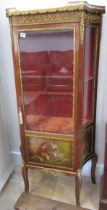 A Continental mahogany and ormolu display cabinet with a single door, 140cm high x 68cm wide