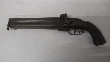 A 19th century unnamed 28 bore double barrelled over and under Howdah pistol with engraved hammer,