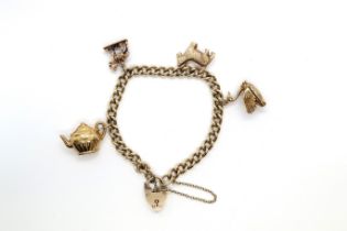 A 9ct gold charm bracelet, the clasp hallmarked 375 - 25.5 grams