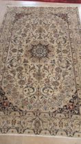 A hand knotted woollen fine Nain rug - 2.92m x 1.90m