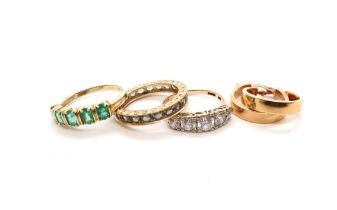 Two 14ct hallmarked yellow gold and emerald rings-eternity and 5 stone- and a pair of 14ct