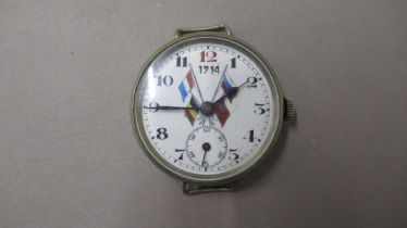 A WWI Commemorative Trench watch with metal case 38mm with enamelled dial dated 1914 and with allied