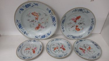 Five 18th/19th century Chinese Famille Rose dishes with fish - each damaged/repaired - graduated