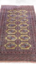 A hand knotted vintage Afghan rug, 213cm x 130cm