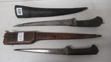 Two Peshkabz daggers with horn handles and leather scabbards, 38cm and 33cm