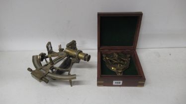 A brass sextant - Henry Barrow & Co London - 22cm - and a brass sundial compass 11cm - boxed