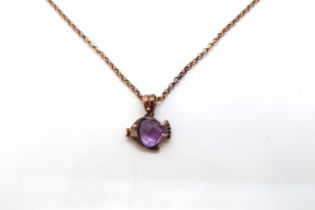 A 9ct rose gold hallmarked and tested chain with an amethyst pendant - approx 61cm, 9 grams