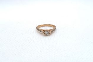 An 18ct rose gold (hallmarked) diamond solitaire ring - The central diamond approx 0.2ct and set