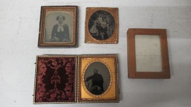 Three Victorian Daguerreotype portraits, on in carved leather case and a Kodak wooden pocket frame